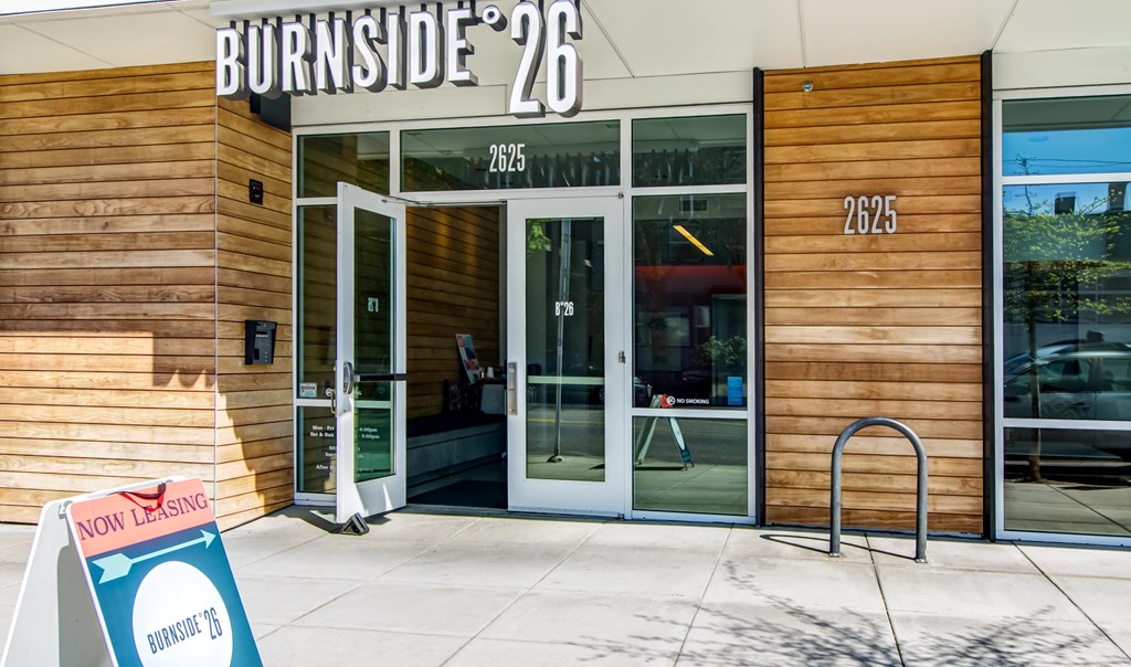Burnside 26 front entrance with "Now Leasing" sign