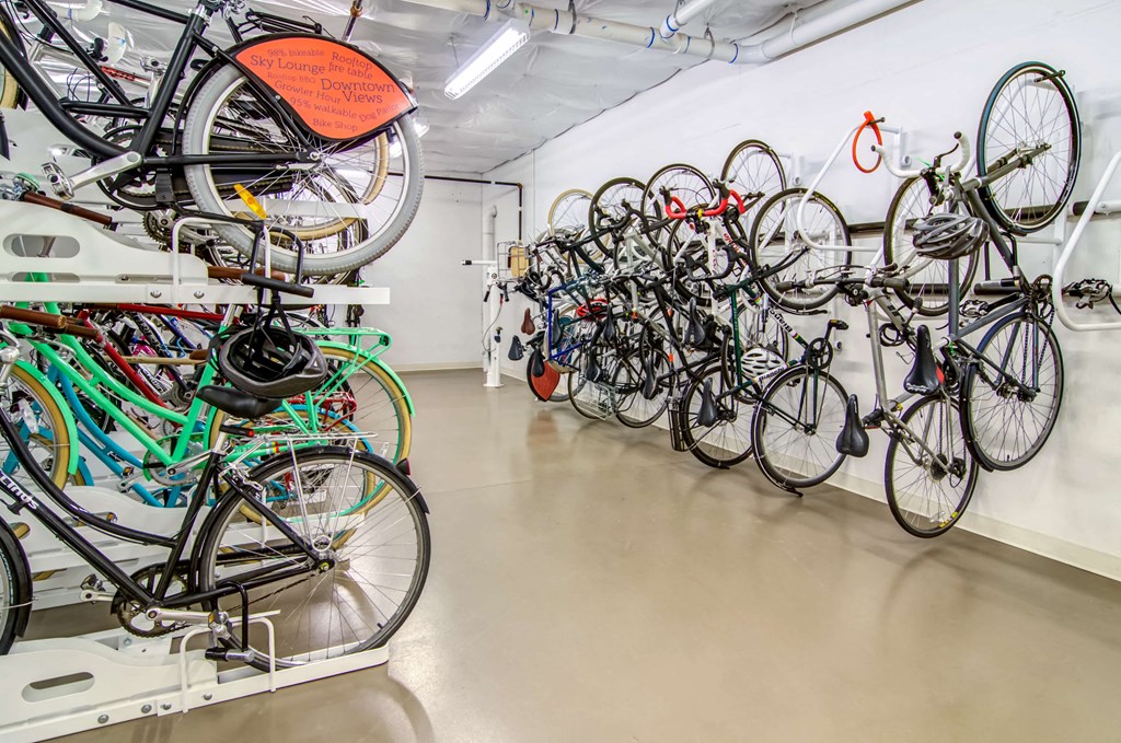 Bicycle storage and repair room with hanging bikes along the walls