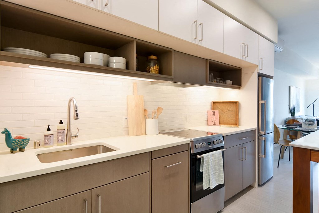 Kitchen with modern appliances and beautifully designed cabinetry