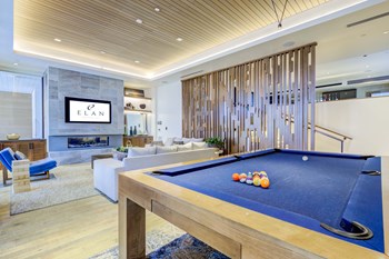 Game room with TV, couches, and pool table