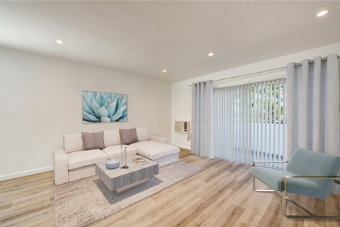 Spacious living area with sliding glass door