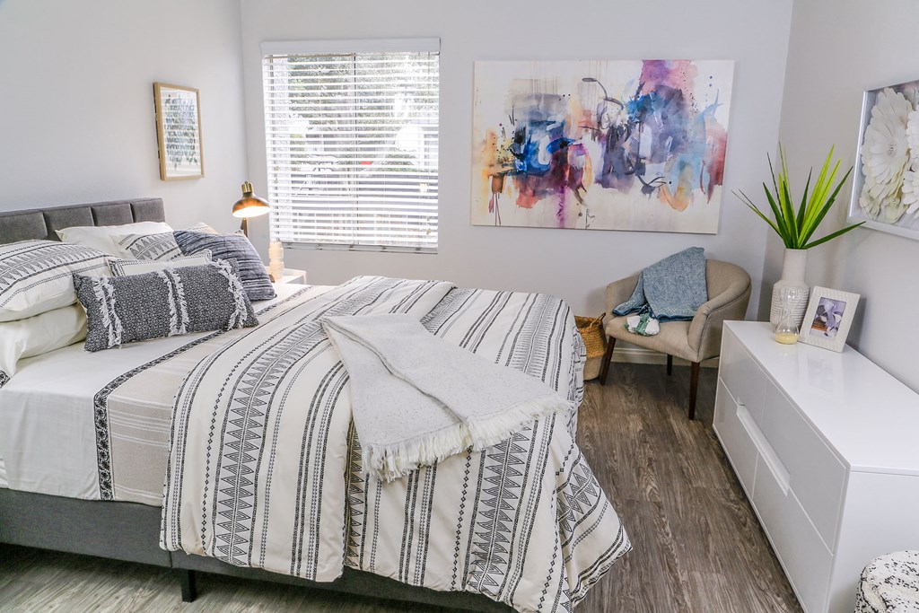 Bedroom With Cozy Decor and Hardwood Style Flooring