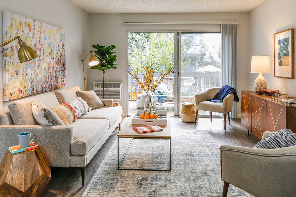 Condo-style, spacious living room with large balcony