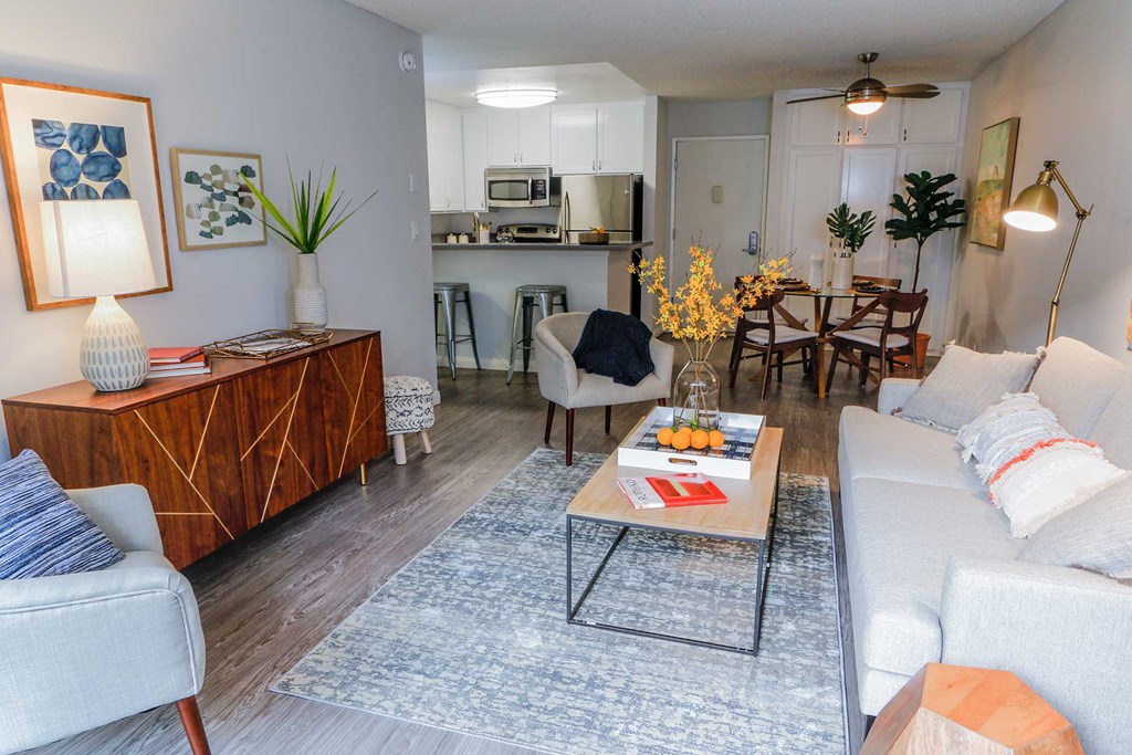 Spacious living room view of fully renovated kitchen