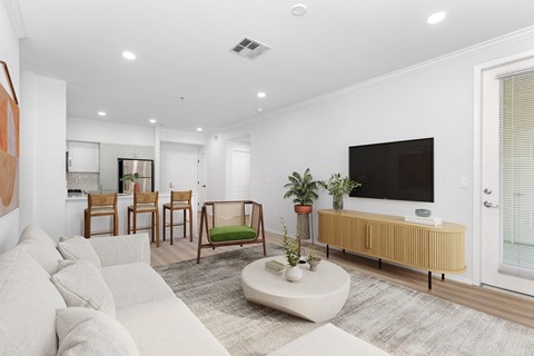 a living room with white walls and a white couch