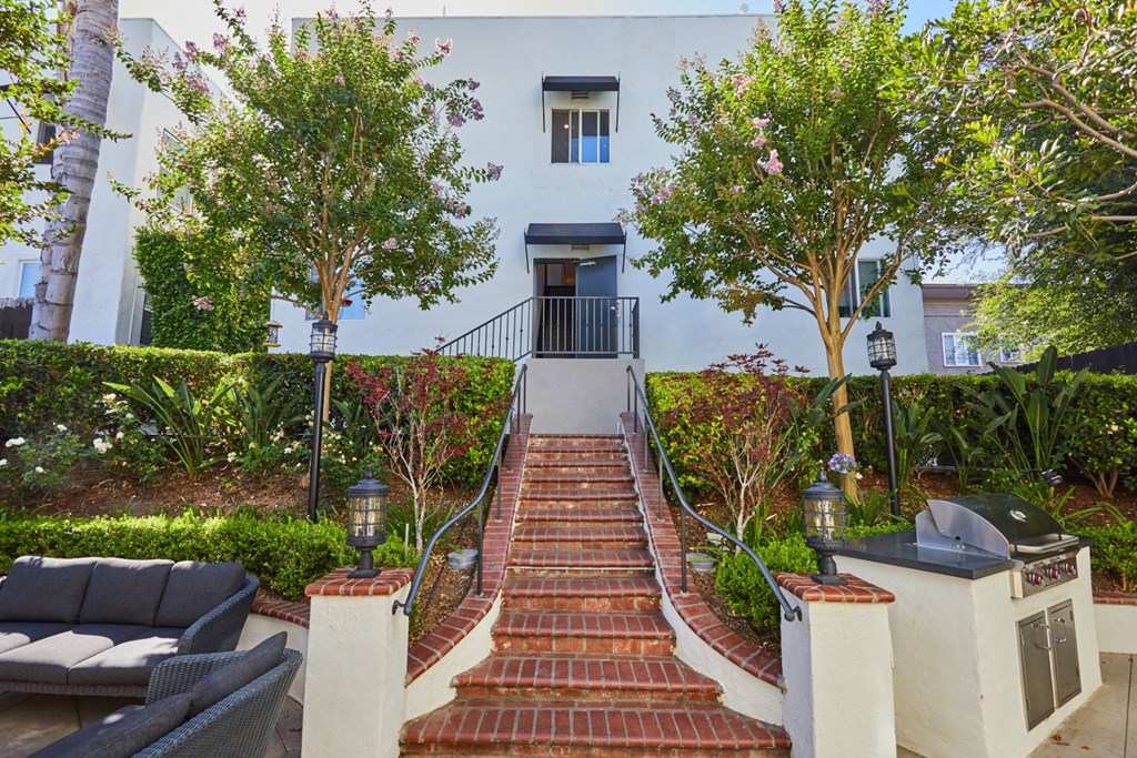 Steps leading up from outdoor lounge and BBQ area