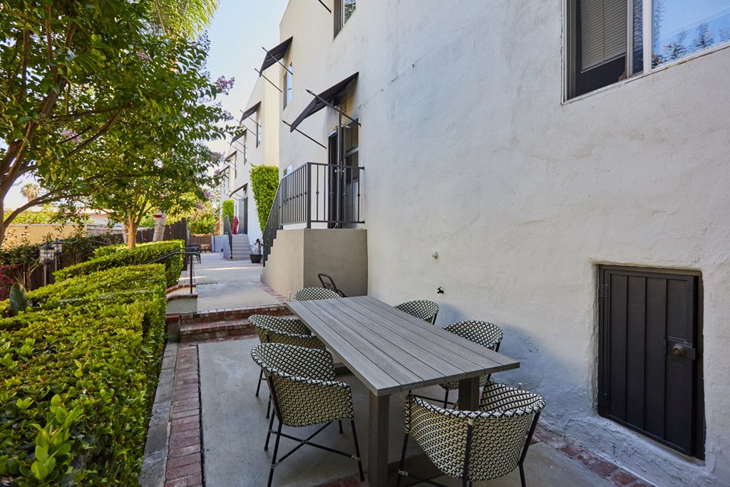 Outdoor Lounge Area with Table and Chairs