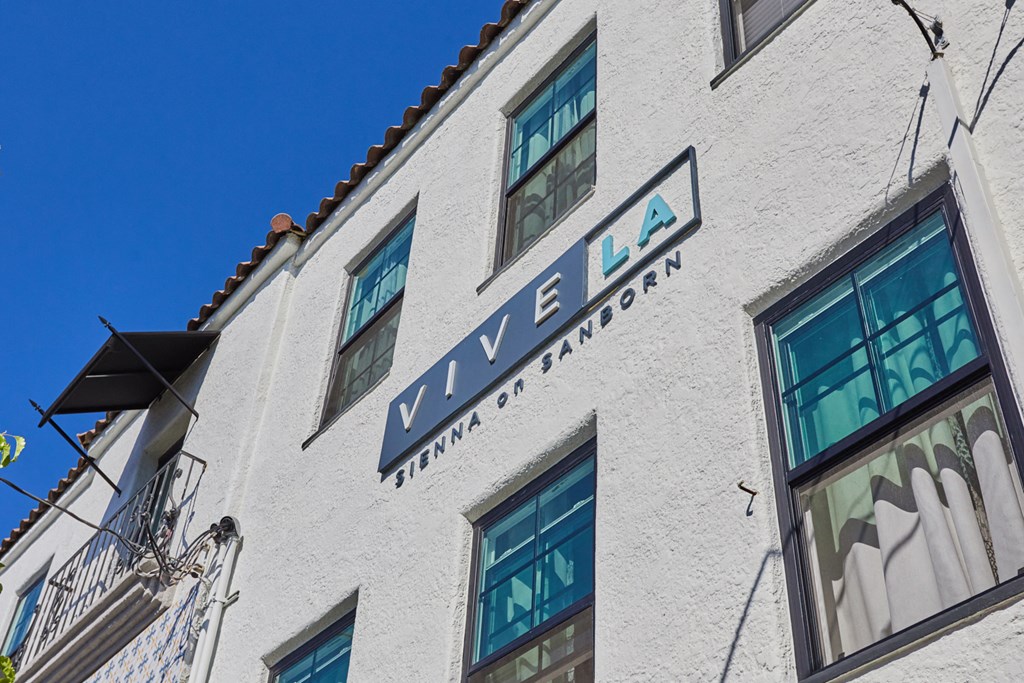 Exterior white wall set against blue sky