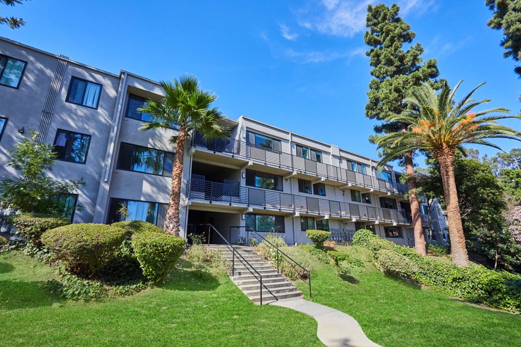 Exterior with green lawn and trees