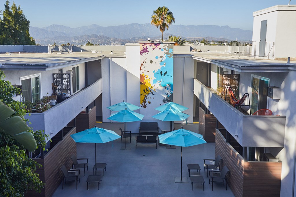 Overlooking courtyard lounge and entire building with mountains behind