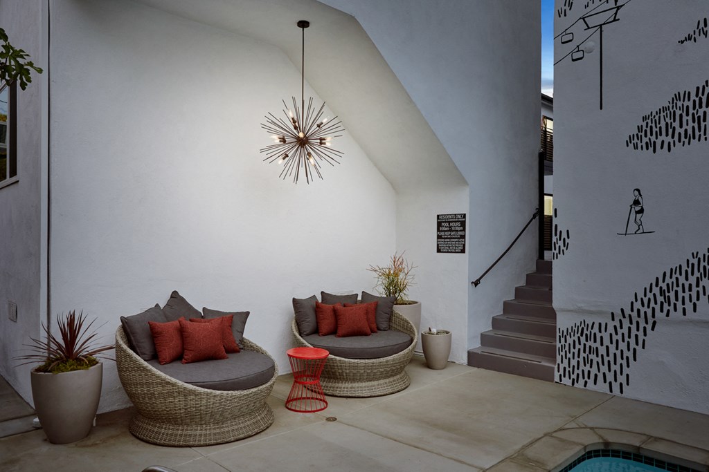 Outdoor Lounge with comfortable chairs and beautiful light fixture