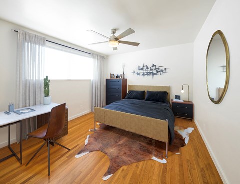 Spacious, beautiful bedroom with wooden floor