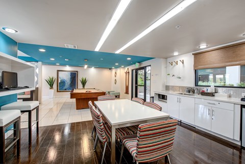 Clubhouse with kitchen, seating, computers, and pool table