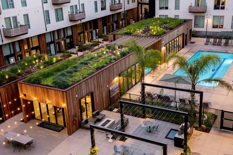 an overhead view of a building with a green roof