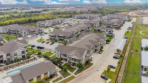 A suburban neighborhood with houses and a pool.