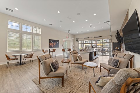 A living room with a large couch and a television.