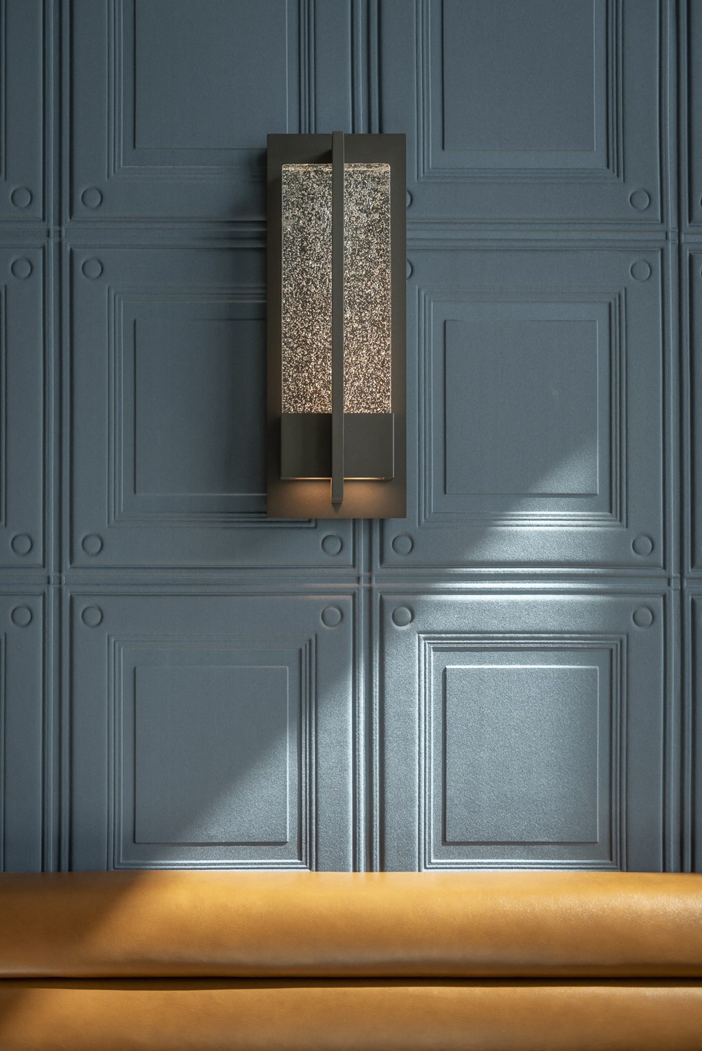 a reflection of a person standing in front of a table