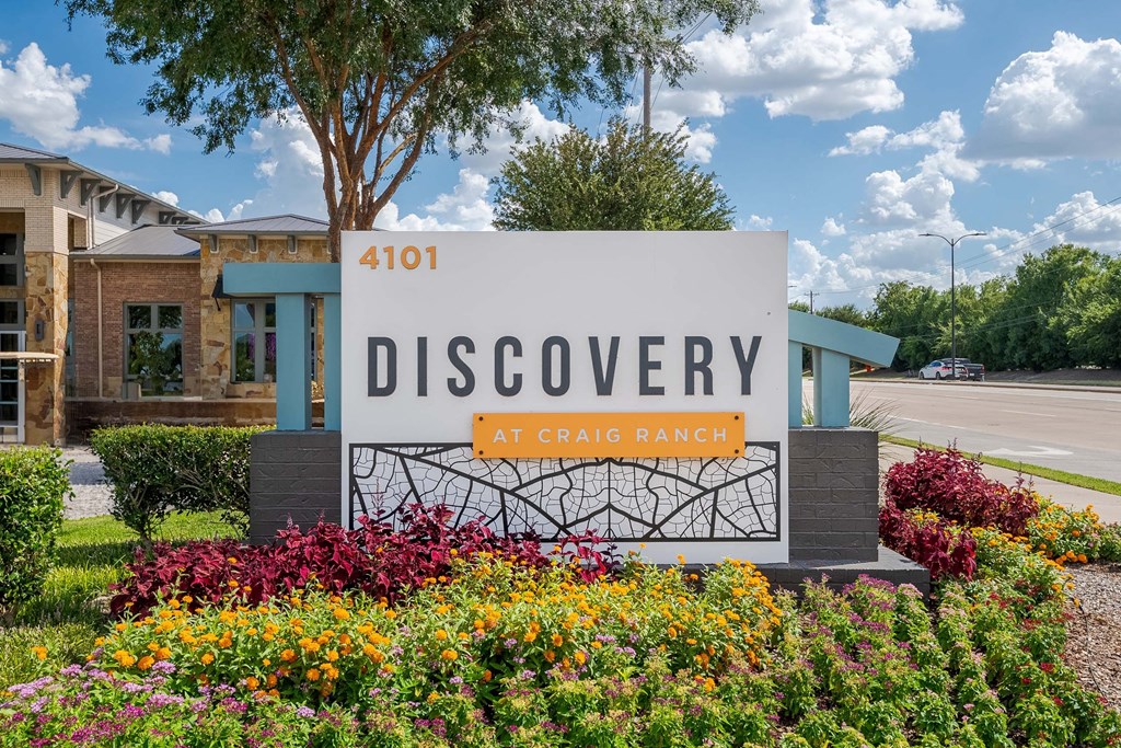a sign for the discovery at craig ranch in front of a building at Discovery at Craig Ranch, McKinney, 75070