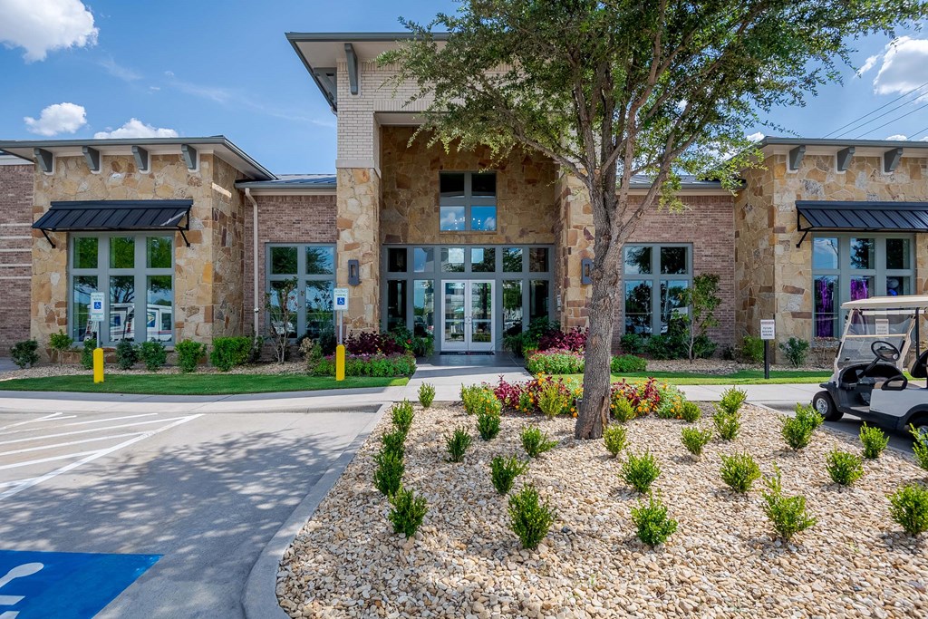 a building with a golf cart parked in front of it at Discovery at Craig Ranch, McKinney, TX, 75070