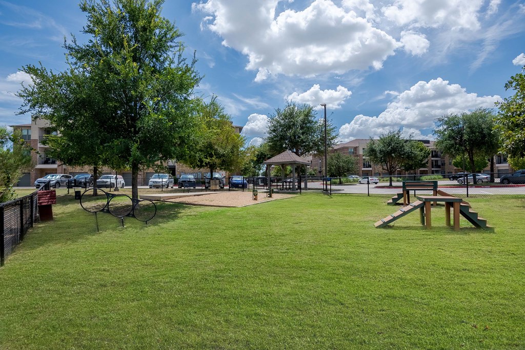 a park with a picnic area and a playground at Discovery at Craig Ranch, Texas