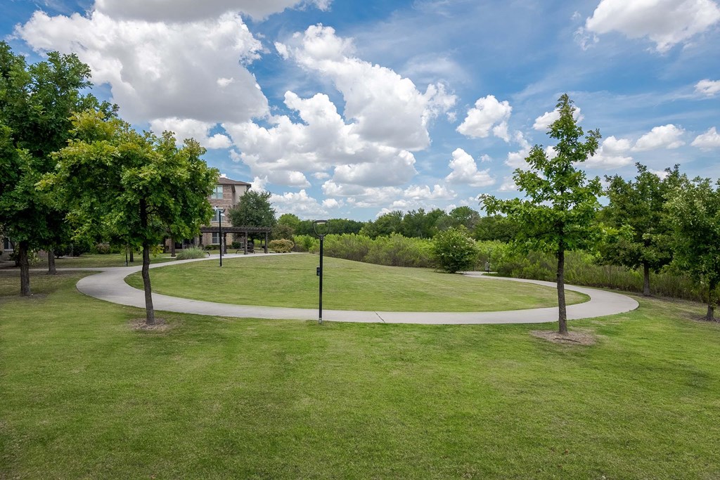 a park with trees and a circular walkway at Discovery at Craig Ranch, McKinney, TX