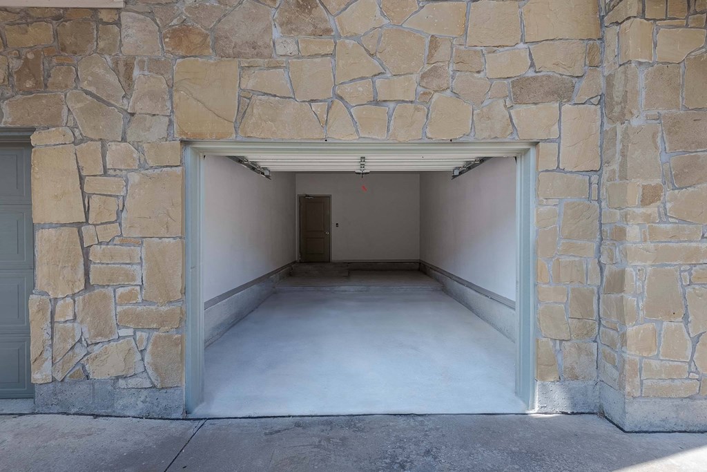 a garage with an open door and a concrete floor at Discovery at Craig Ranch, McKinney, TX, 75070