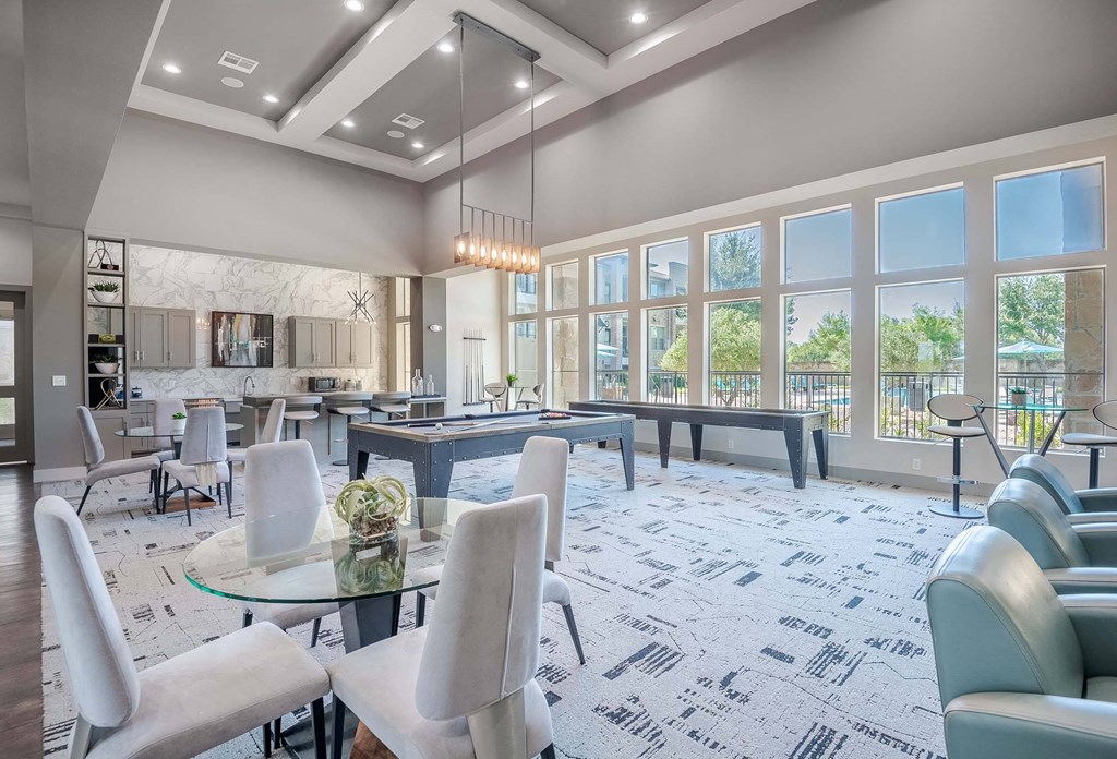a gathering room with tables and chairs and large windows at Discovery at Craig Ranch, Texas