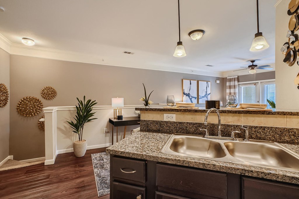 a kitchen with a sink and a counter top  at Grand Villas Apartments, Texas, 77494