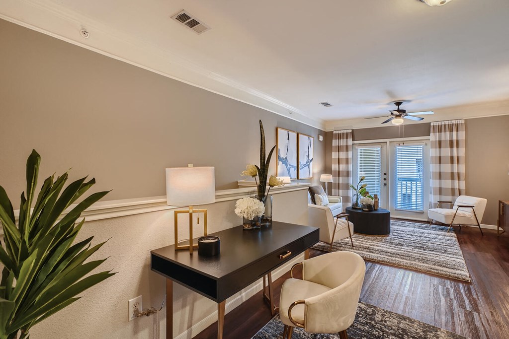 a living room filled with furniture and a table  at Grand Villas Apartments, Texas