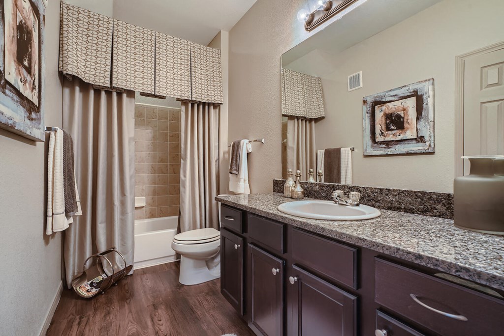 a bathroom with a sink and a toilet  at Grand Villas Apartments, Texas, 77494