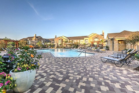 Daytime pool deck and exterior of apartments at Waterstone at Cinco Ranch, Texas, 77450