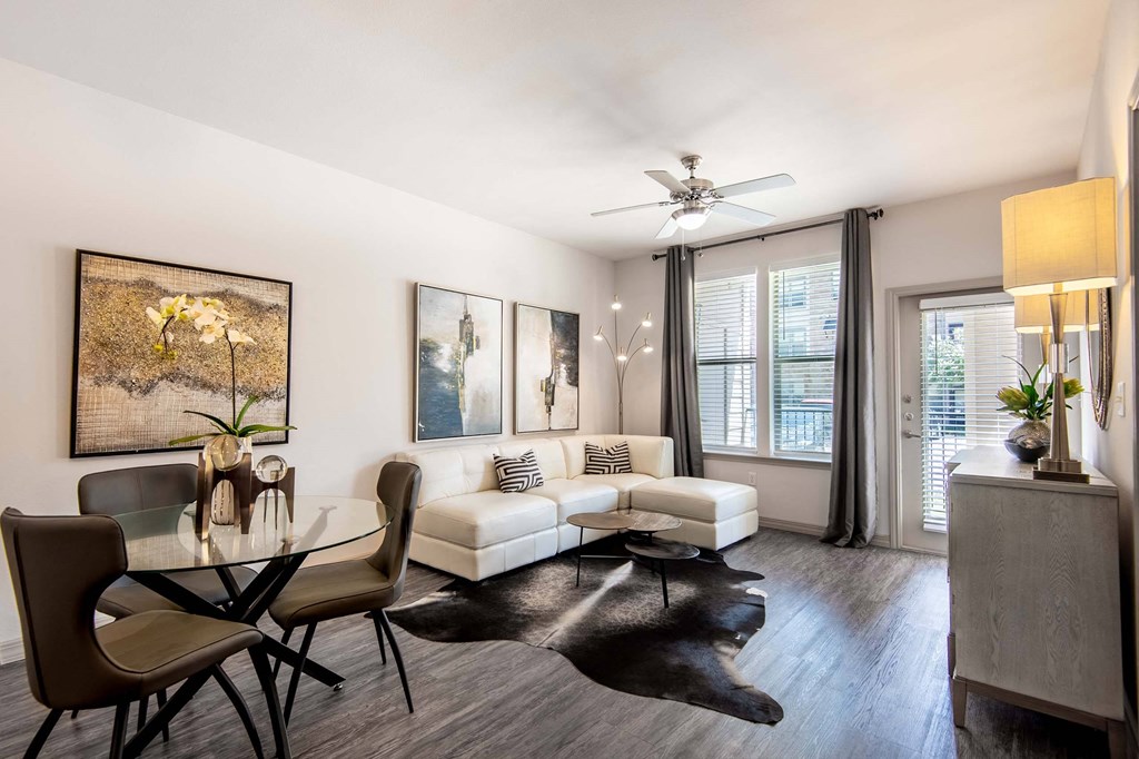 a living room with a couch and a table at Discovery at Craig Ranch, Texas, 75070