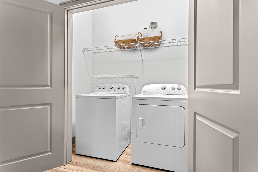 A white dishwasher and dryer in a kitchen.