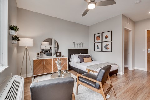 Studio apartment with modern furniture and wood flooring at Marquee Apartments, Minneapolis, Minnesota
