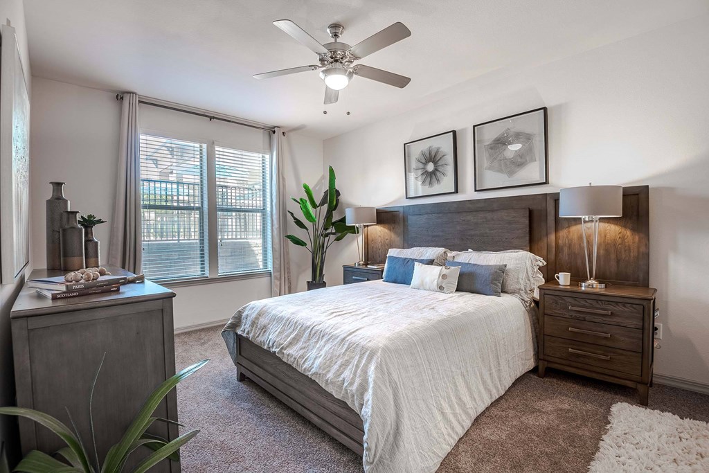 a bedroom with a bed and a ceiling fan at Discovery at Craig Ranch, McKinney, TX