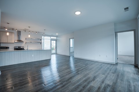 Spacious room with wooden floor at 747 Apartments, Indianapolis