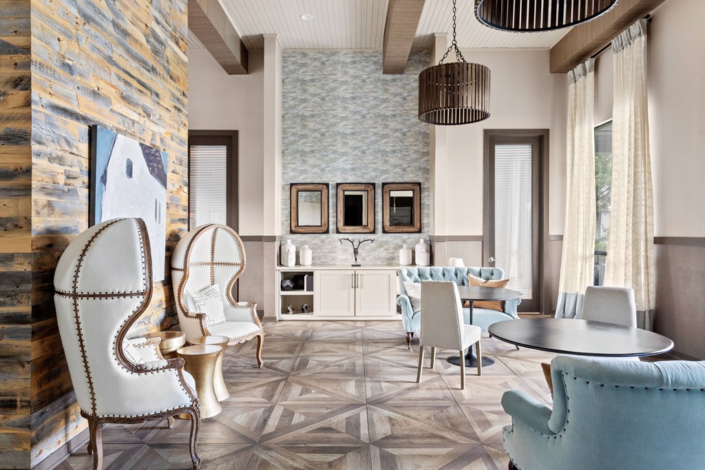 A modern living room with a stone wall and a star patterned floor.