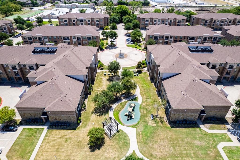 an aerial view of a neighborhood with houses and a playground at Discovery at Craig Ranch, McKinney, TX