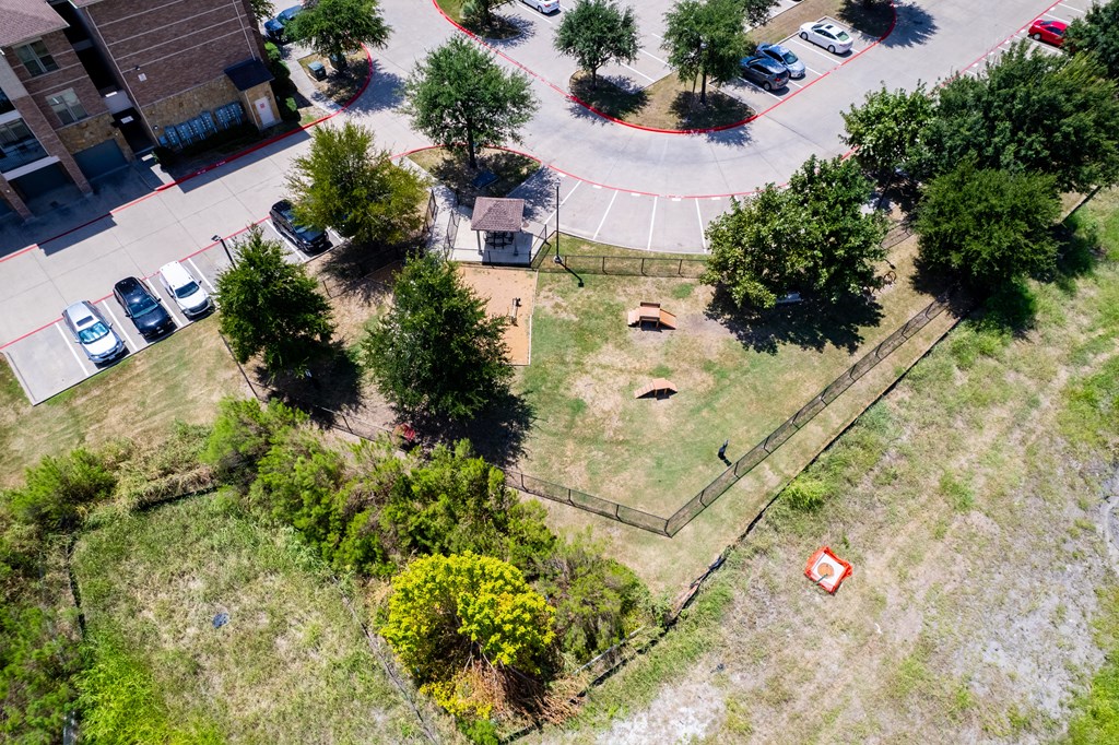 an aerial view of a yard with trees and a parking lot at Discovery at Craig Ranch, McKinney, TX, 75070