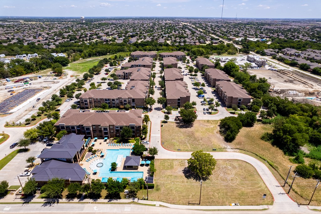 an aerial view of a neighborhood with houses and a swimming pool at Discovery at Craig Ranch, McKinney, TX