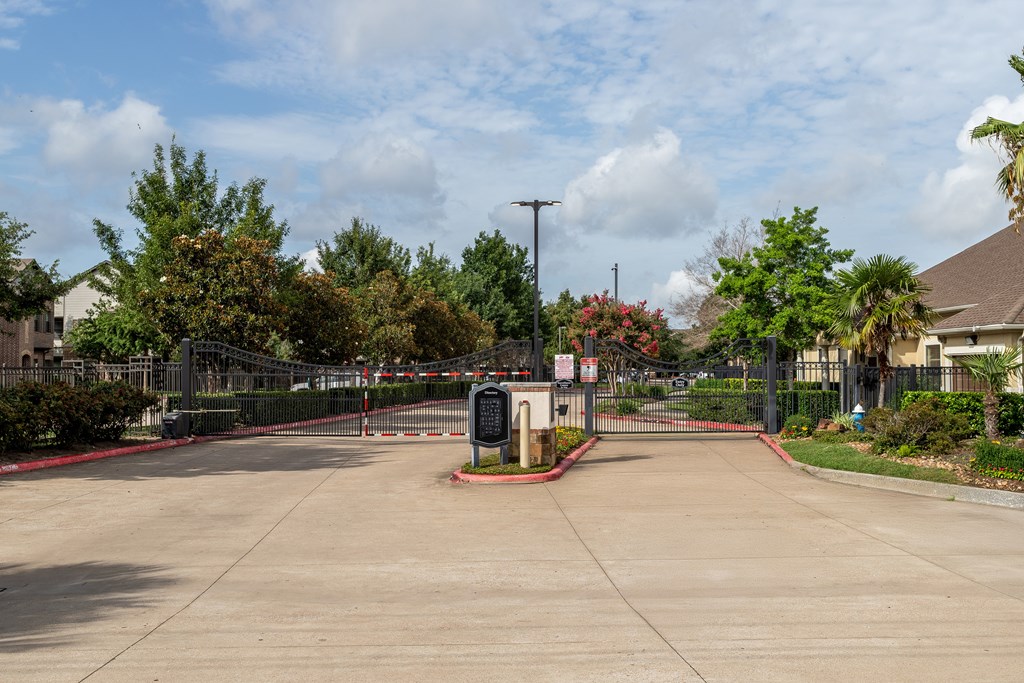 Sunny day at the entrance of a gated community at Grand Villas at Cinco Ranch, Texas