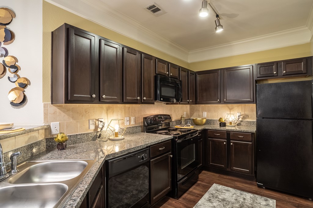 Kitchen with cabinets at Grand Villas at Cinco Ranch, Texas, 77494