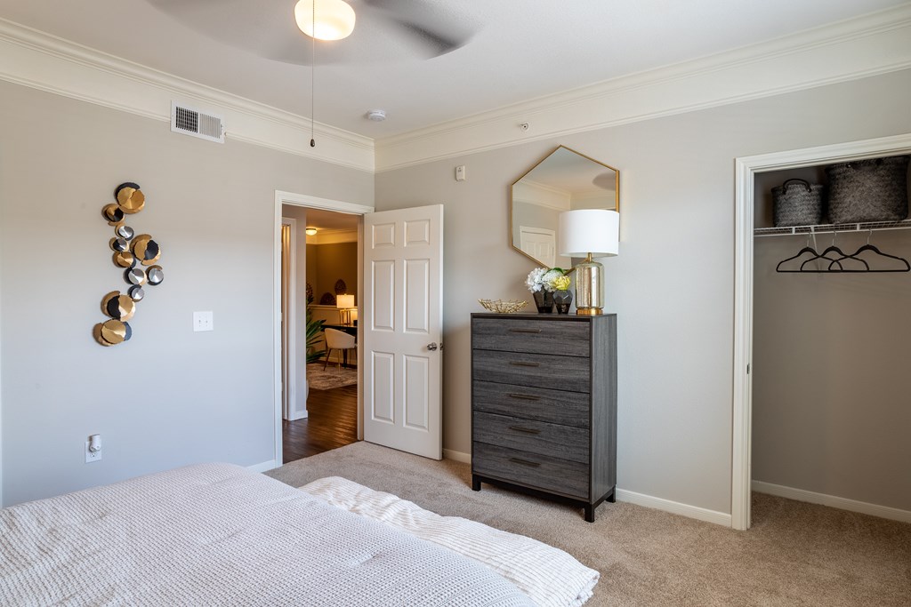 Bedroom with a mirror at Grand Villas at Cinco Ranch, Katy, TX