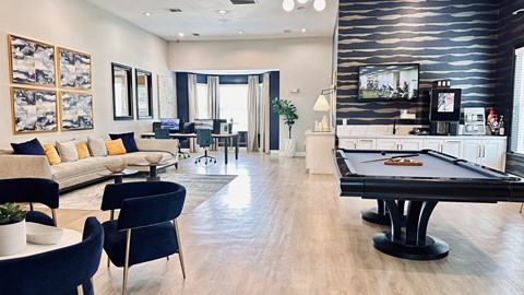 a living room with a pool table and a tv at Waterstone at Cinco Ranch, Katy, TX, 77450