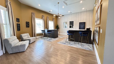a living room with a couch and a bar at Waterstone at Cinco Ranch, Katy, TX, 77450