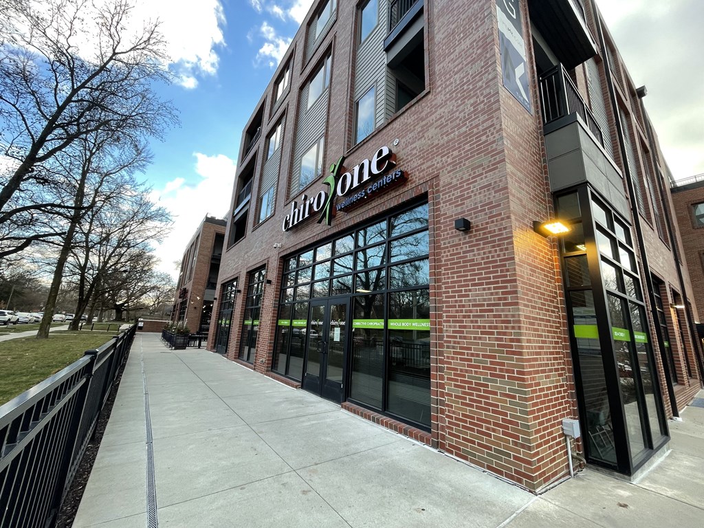 a brick building with a sign on the side of it