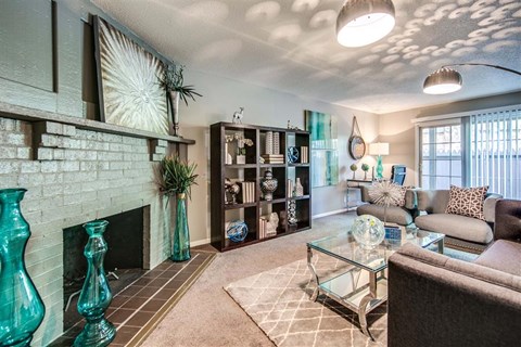 a living room filled with furniture and a fireplace