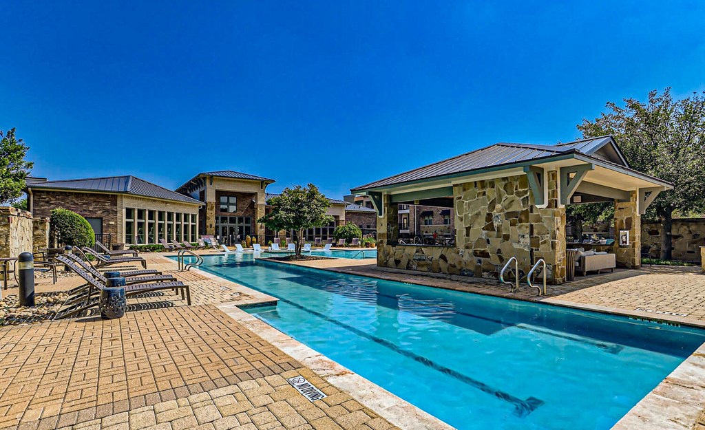 a swimming pool with a pavilion next to a resort style pool at Discovery at Craig Ranch, McKinney, TX