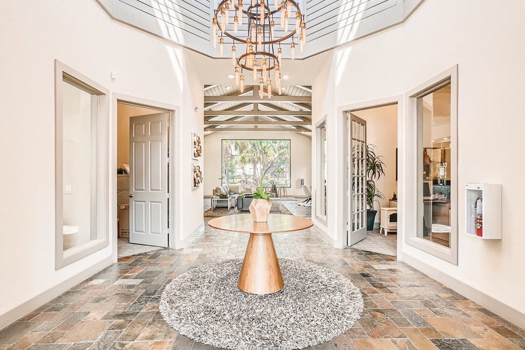 a foyer with a round table and a chandelier at River Pointe, Conroe, TX, 77304