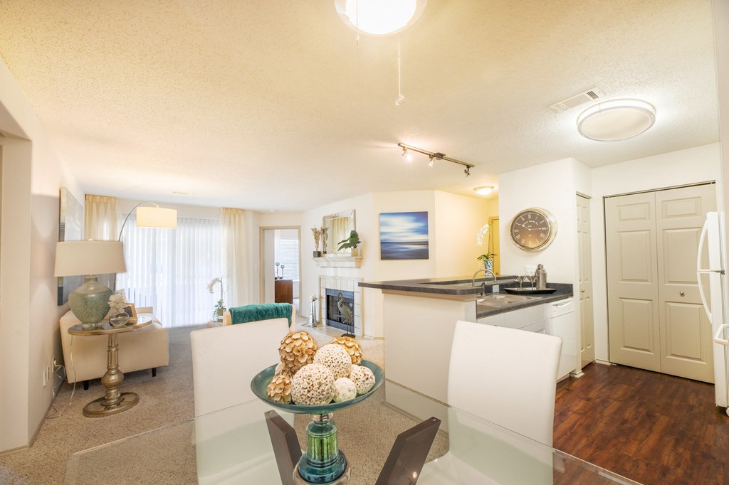 a living room and kitchen with a table and chairs and a kitchen counter top  at Butternut Ridge, North Olmsted, OH, 44070